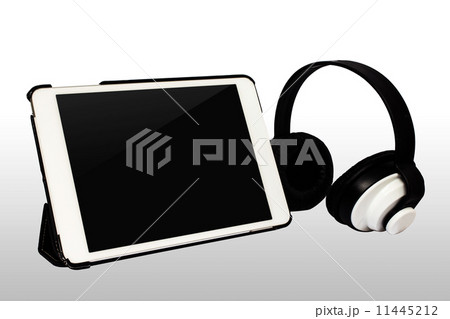 Tablet PC and Headphones isolated on white background Tablet PC and Headphones isolated on white background 11445212