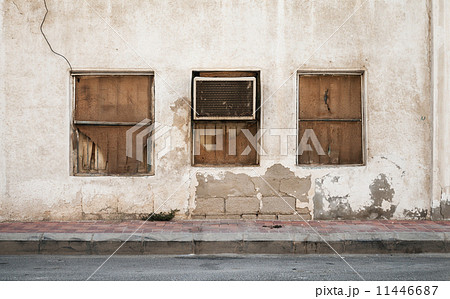 Old building wall with windows and outer air conditioner device. 11446687