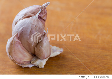cloves of garlic on yellow wooden background cloves of garlic on yellow wooden background 11450620