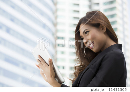 Businesswoman used tablet for search and work 11451306