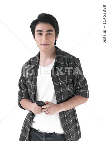 Young asian man in relax style and holding the cell phone 11453389