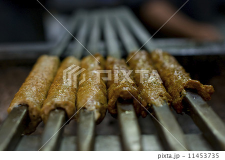 Close-up delicious seekh kabab being barbecued Close-up delicious seekh kabab being barbecued 11453735