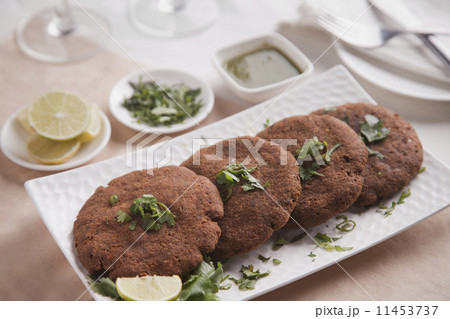Close-up of fried cutlets arranged in plate 11453737