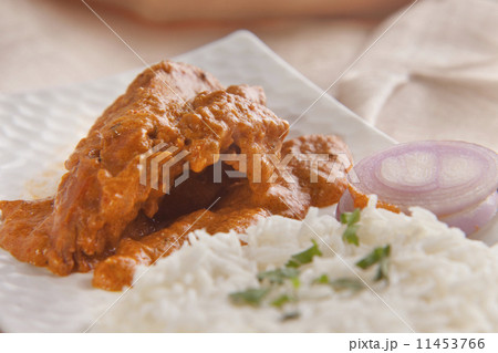 Butter chicken served with rice 11453766