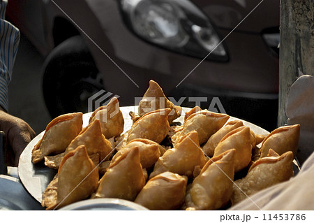 Fresh samosas for sale at street stall 11453786