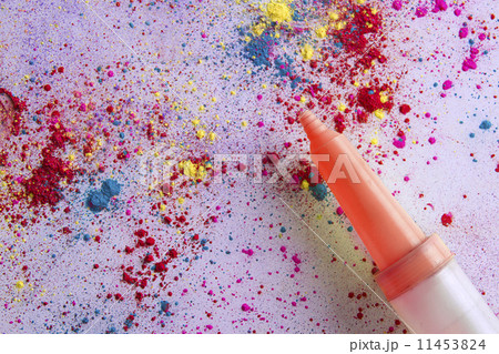 Water gun on colorful powder paint spread over white background Water gun on colorful powder paint spread over white background 11453824