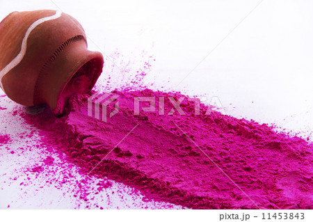 Pink Holi color powder spilt from pot over white background Pink Holi color powder spilt from pot over white background 11453843