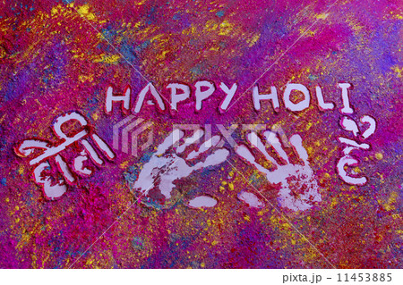 Handprints with text HAPPY Holi written on rangoli 11453885