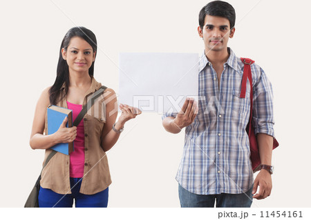 Portrait of college students holding a white board Portrait of college students holding a white board 11454161