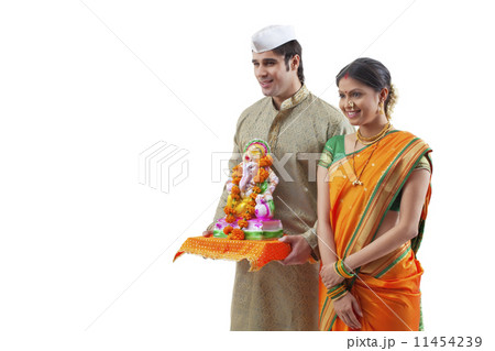Maharashtrian couple with a Ganesh idol 11454239