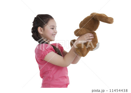Little girl holding a toy rabbit 11454438