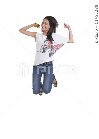 Full length of happy young woman jumping isolated over white background 11455288