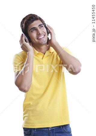 Young man listening to music Young man listening to music 11455450