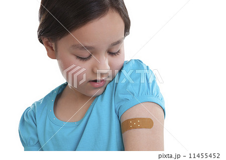Little girl with band-aid on arm 11455452