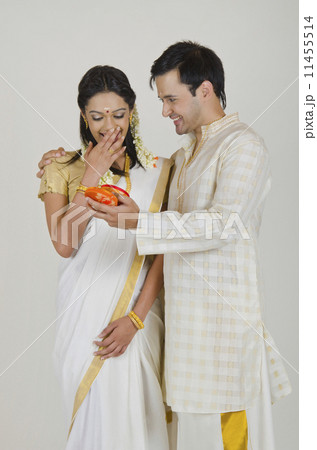 South Indian man surprising wife with jewelery 11455514