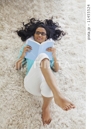 Woman with a book thinking Woman with a book thinking 11455524