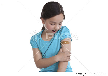 Little girl with band-aid on arm Little girl with band-aid on arm 11455596