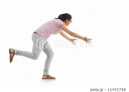 Young woman trying to catch Young woman trying to catch 11455788