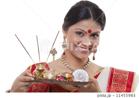 Portrait of a Bengali woman holding a puja thali 11455983