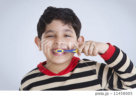 Portrait of little boy brushing his teeth Portrait of little boy brushing his teeth 11456005