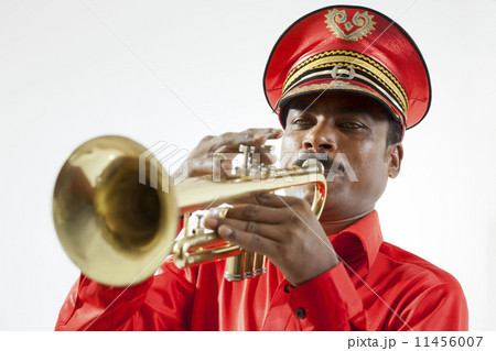 Bandmaster playing on a trumpet 11456007
