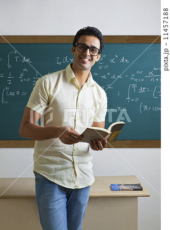 Portrait of a college student with a book Portrait of a college student with a book 11457188