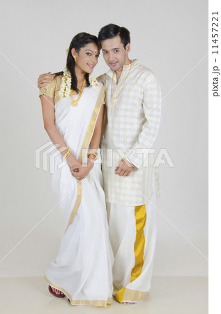 South Indian Wedding Couple Greeting Namaste In Traditional Dress Of Tamil  Nadu. 24144085 Vector Art at Vecteezy