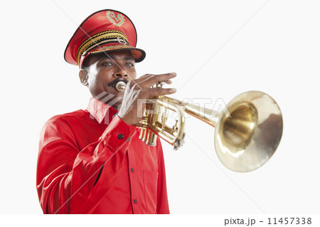 Bandmaster playing on a trumpet Bandmaster playing on a trumpet 11457338