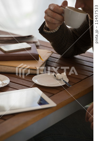 Businessman using tablet computer cafe Businessman using tablet computer cafe 11457533