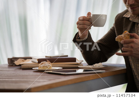 Businessman using tablet computer cafe 11457534
