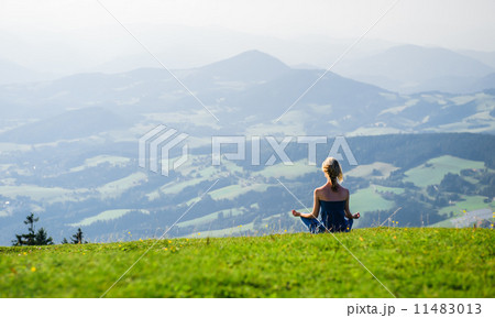 Young woman meditating outdoors 11483013