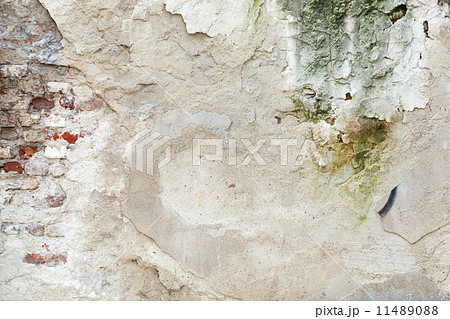 Old grunge brick wall with cracked stucco. Background texture Old grunge brick wall with cracked stucco. Background texture 11489088