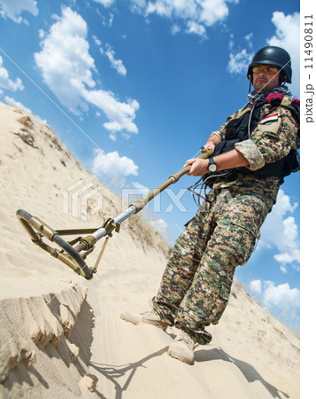 soldier with metal detector 11490811