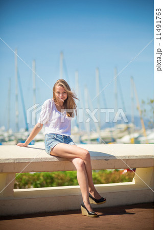 Young girl enjoying her vacation by the sea 11491763
