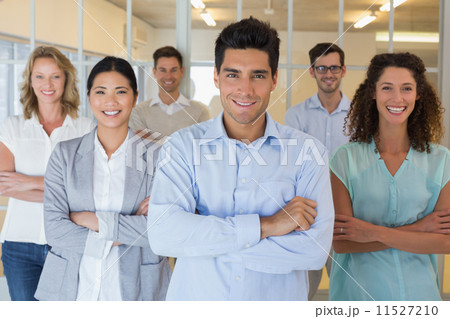 Casual business team smiling at camera with arms crossed 11527210