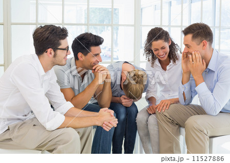 Group therapy in session sitting in a circle 11527886