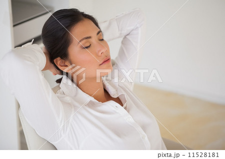 Casual businesswoman napping at her desk Casual businesswoman napping at her desk 11528181