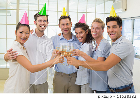 Casual smiling business team toasting with champagne 11528332