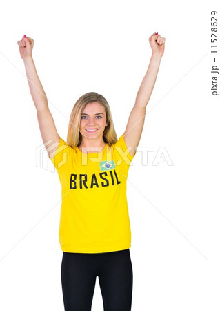 Excited football fan in brasil tshirt 11528629