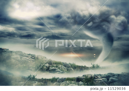 Stormy sky with tornado over landscape 11529036