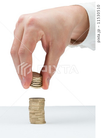 Businessman counting his coins at desk Businessman counting his coins at desk 11530510