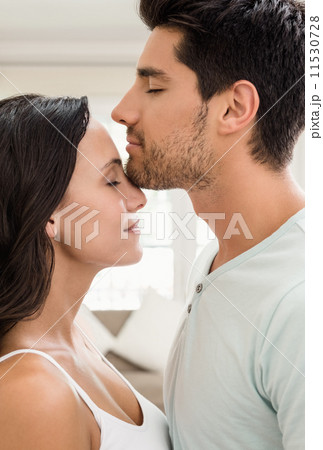 Attractive couple standing and hugging 11530728