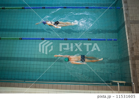 Man and woman swimming in the pool Man and woman swimming in the pool 11531605