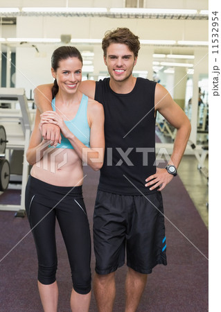 Fit attractive couple smiling at camera 11532954