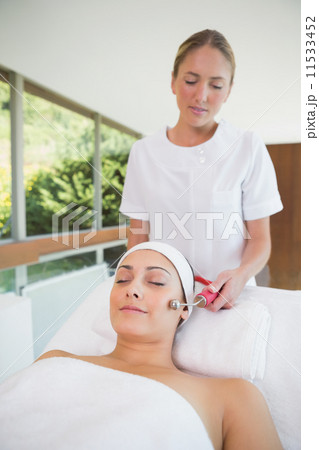 Peaceful brunette getting micro dermabrasion Peaceful brunette getting micro dermabrasion 11533452