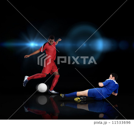 Football players tackling for the ball Football players tackling for the ball 11533696