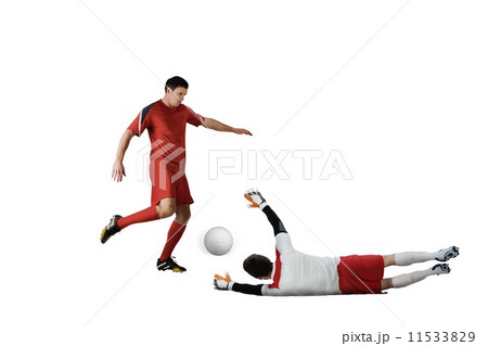 Football players tackling for the ball Football players tackling for the ball 11533829