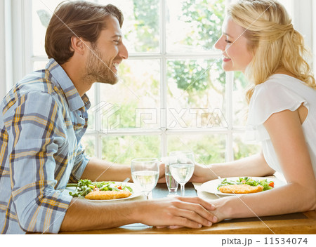 Happy couple enjoying a meal together 11534074