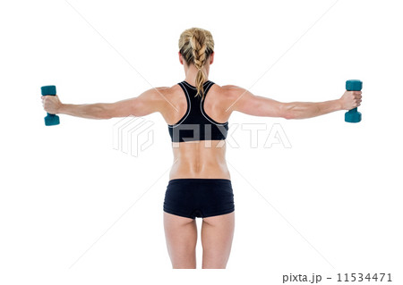 Female bodybuilder holding two dumbbells with arms out 11534471