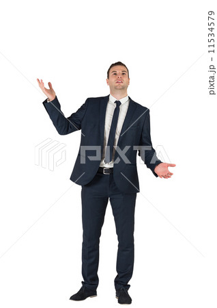 Businessman standing with hands outstretched Businessman standing with hands outstretched 11534579